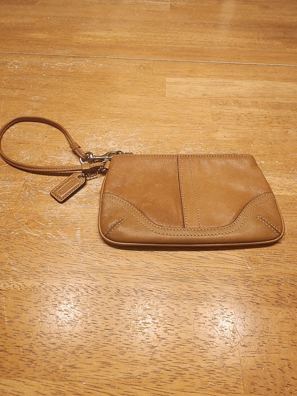 vintage Coach Soho leather wristlet, featuring a classic tan leather